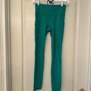 Athleta women’s XS stash pocket salutation tight with Power Vita fabric